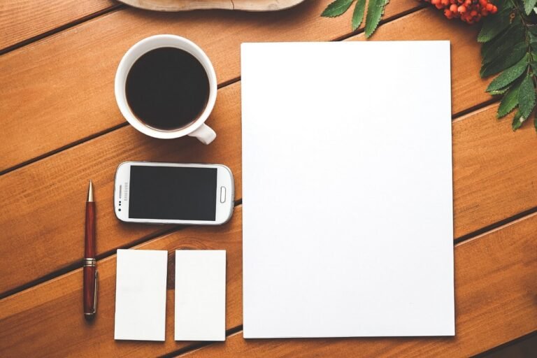 Paper Pen Coffee and Mobile on Table